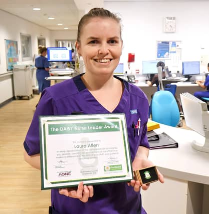 Laura Allen with her DAISY Leader Award.