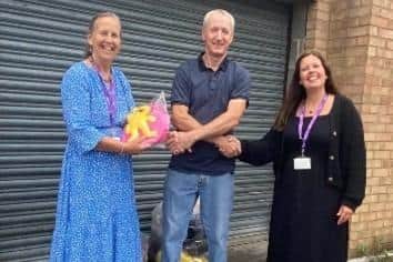 Mark Austin, from Market Walk Shopping Centre, with volunteers from Age UK Northamptonshire.