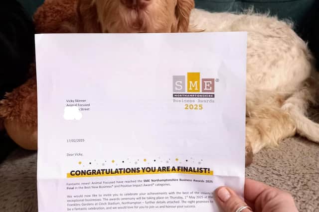 Animal Focused therapy dog, Hero, with their finalist notification.