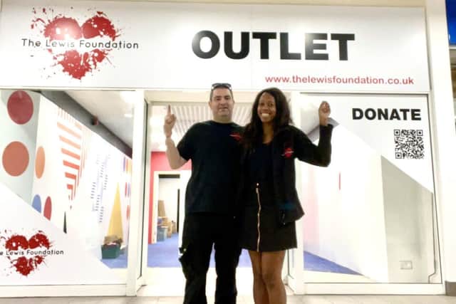 Lorraine and Lee Lewis outside The Lewis Foundation outlet store