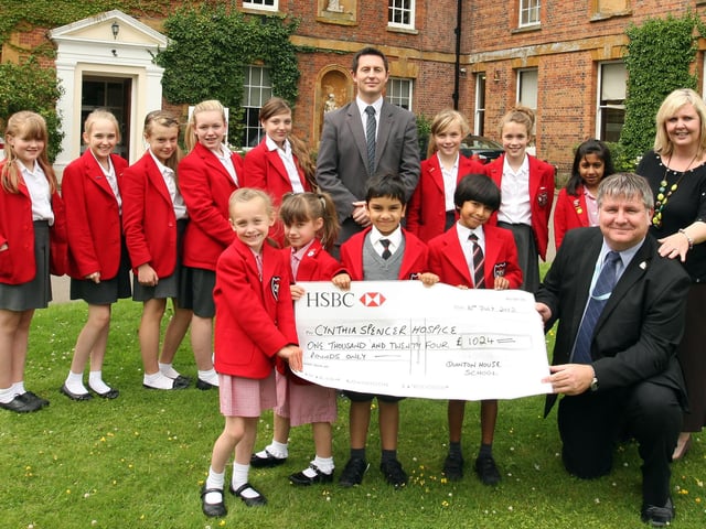 Supporting Women: Northampton: Quinton House School, Upton Hall, Northampton, pupils and staff fashion show for Cynthia Spencer Hospice, raised more than £1,024. Cheque Presentation John Helm fundraising manager with head teacher Geraint Jones and organiser Lisa Sarjeant