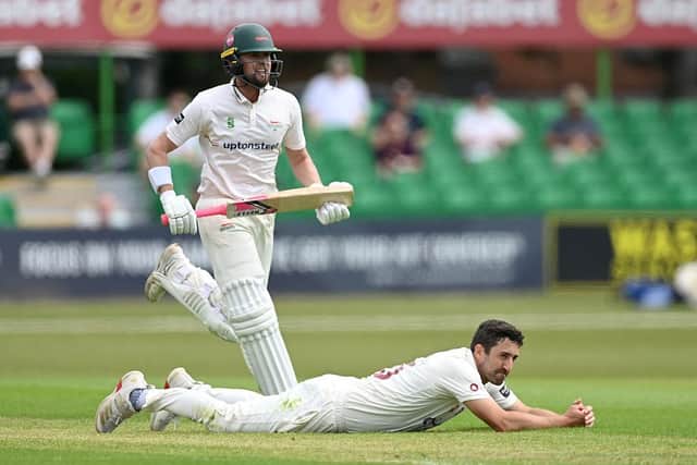Ben Sanderson lies on the ground after Sol Budinger of Leicestershire had hit the ball past him for a four