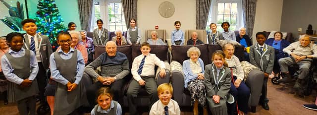 Elm Bank Care Home enjoys the festive joy delivered by the children from St Peter's School in Kettering.