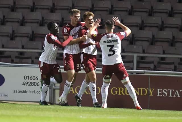 NORTHAMPTON, ENGLAND - OCTOBER 18: Josh Tomlinson of Northampton Town celebrates after scoring his sides first goal during the Papa John's Trophy match between  Northampton Town and Arsenal U-21 at Sixfields on October 18, 2022 in Northampton, England. (Photo by Pete Norton/Getty Images)