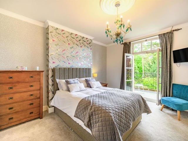 This Victorian home has a tennis court, huge gardens and a private mooring on the River Nene.