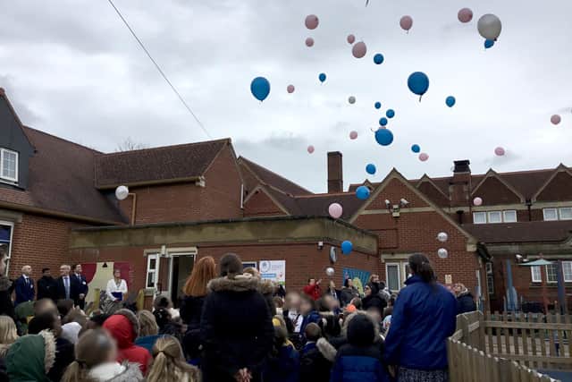Balloons were released by children at Park Infant Academy in tribute to Janvi and Jeeva Saju