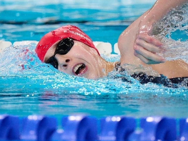 Paralympian Eliza competing in the 100m crawl