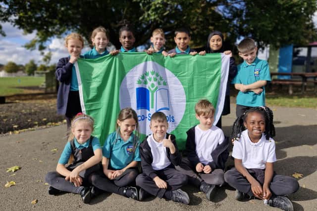 Members of the Castle Academy eco-committee with their Eco-School Green Flag.