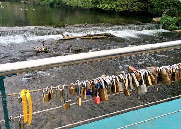 'Love locks', padlocks inscribed which a couple's intials, on a bridge in Bakewell