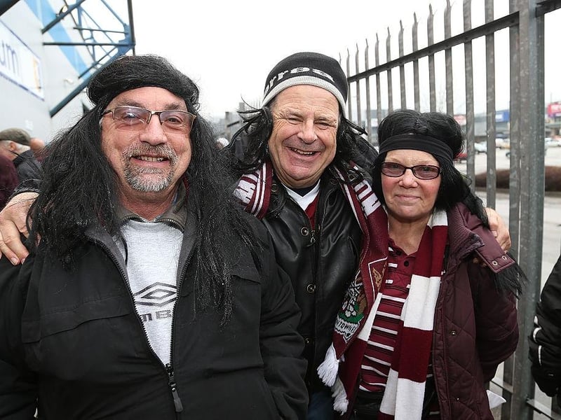 Northampton Town fans wear long hair wigs and headbands in homage to John-Joe O'Toole prior the Sky Bet League Two match between Mansfield Town and Northampton Town at One Call Stadium on February 14, 2015.