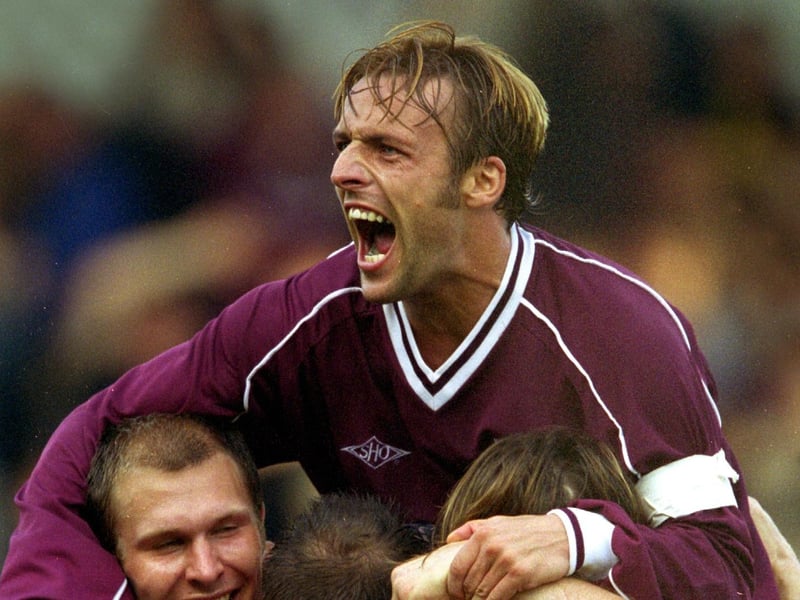 Northampton Town's Roy Hunter shows his delight as players celebrate the 4th goal scored by Jamie Forrester during the Nationwide League Division Two match played between Northampton Town (4) and Tranmere Rovers (1) at the Sixfields stadium in Northampton England. DIGITAL IMAGE. Mandatory Credit: Pete Norton / Allsport