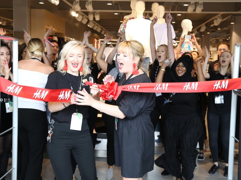 Cutting the ribbon at H&M on opening day