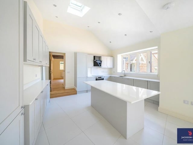 A modern kitchen with an island worktop
