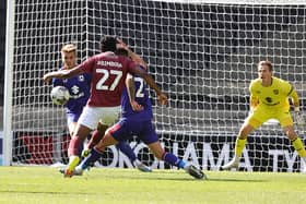 Peter Abimbola curls in a wonderful late goal during Saturday's pre-season friendly between MK Dons and Northampton. Pictures: Pete Norton / Getty