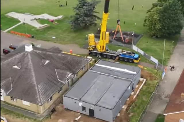 A crane was used to get five modular buildings in place at the site in King's Heath. Photo: Northampton General Hospital NHS Trust/YouTube.