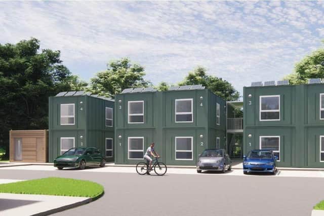 Three detached houses side by side