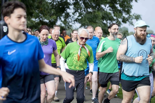 The 90-year-old was met by hundreds of people cheering him on as he reached the milestone at the Racecourse.