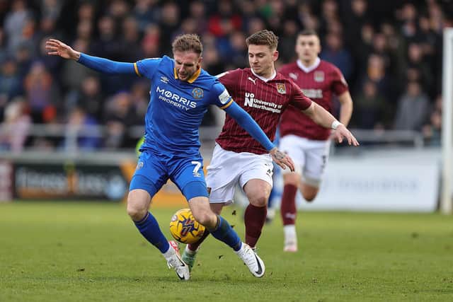 Sam Hoskins battles for the ball during the Cobblers' clash with Shrewsbury Town (Photo by Pete Norton/Getty Images)