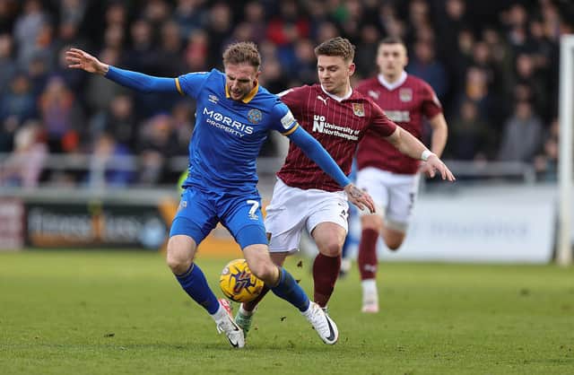 Sam Hoskins battles for the ball during the Cobblers' clash with Shrewsbury Town (Photo by Pete Norton/Getty Images)