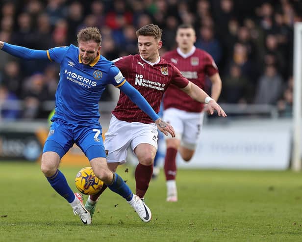 Sam Hoskins battles for the ball during the Cobblers' clash with Shrewsbury Town (Photo by Pete Norton/Getty Images)