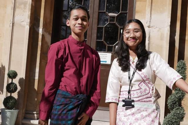 A Level students from South East Asia wearing traditional clothing.