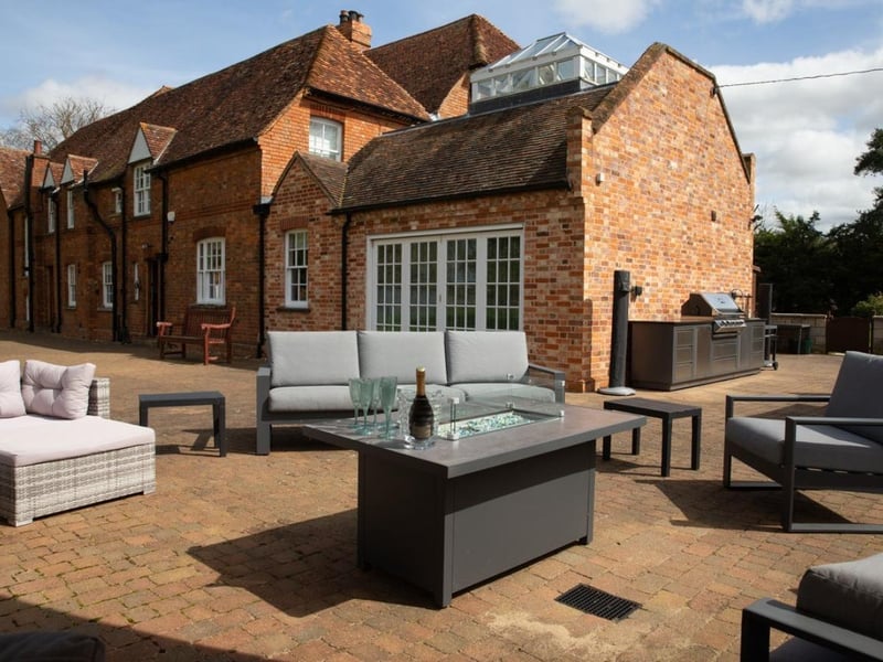 Can you see yourself catching some rays and kicking back with a good book here? There's an outdoor grill and plenty of seating for your summer parties