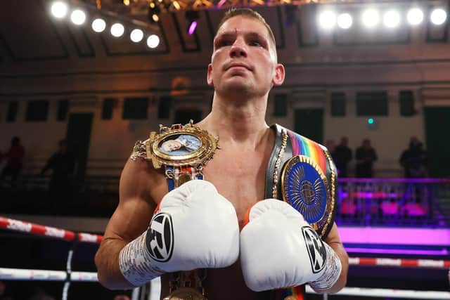 Ash Lane celebrates with the title belts after his British bantamweight title fight win over Chris Bourke (Photo by James Chance/Getty Images)