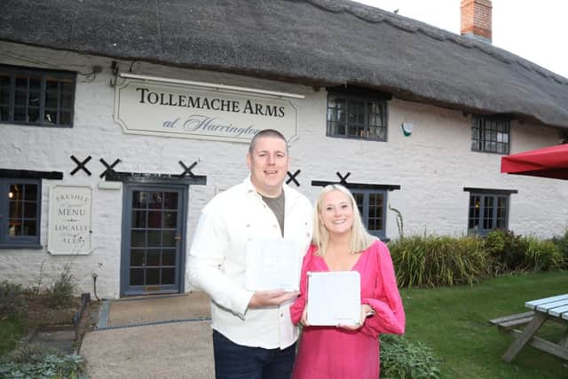 Joe Buckley and Flo Pearce outside The Tollemache Arms - 'The Tolly' in Harrington named as the overall winner in The Great British Pub Awards/National World
