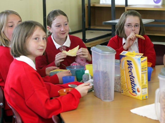 Breakfast Club at Wootton Primary School - students / pupils sit down for breakfast in preparation for their year 6 SATs exams....