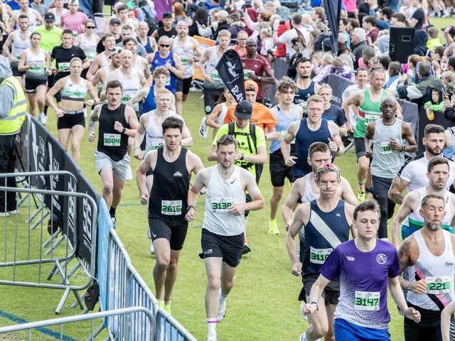 Hundreds of runners braved showers and wind to take on the race on Sunday (May 25), which started and finished at Sixfields stadium.