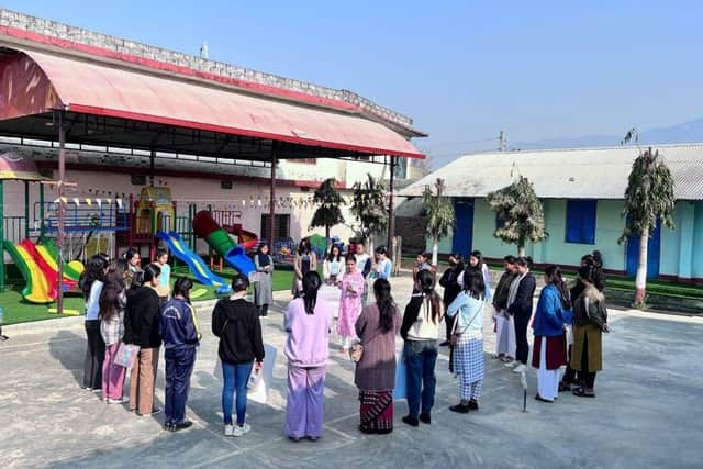 Young women in Nepal learning to express themselves in a safe space aided by the ISII.