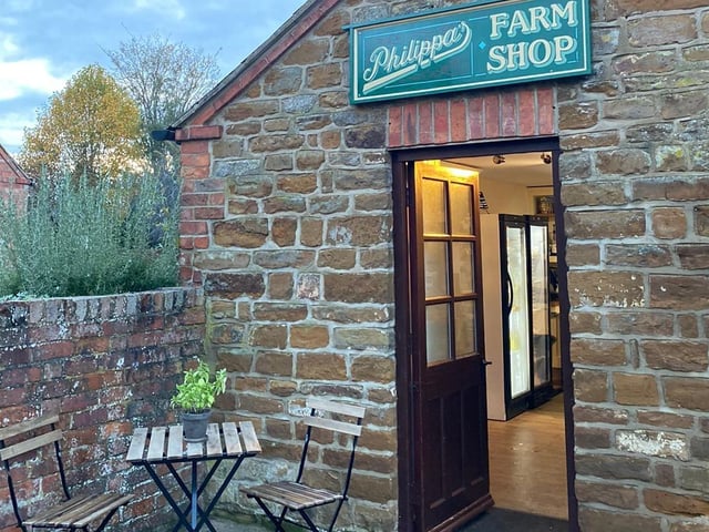 Philippa’s Farm Shop entrance is pictured with plant and flower stands.