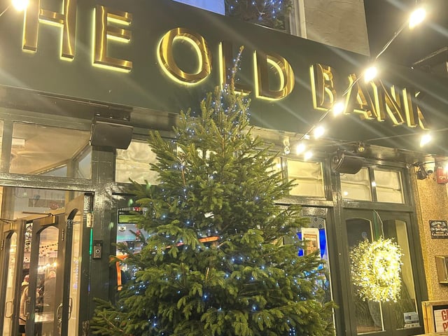 The Old Bank with 2 of the donated 5ft trees displayed on the roof and a 10ft tree purchased separately from Stoke Goldington Farm by The Old Bank.