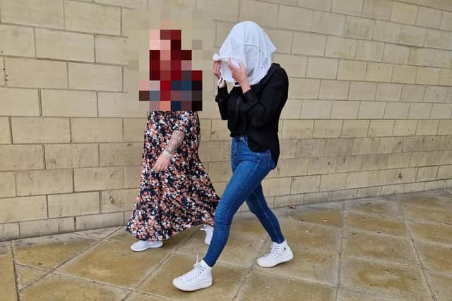 Rachel Stanton (on right) leaves Northampton Crown Court with her head in a tote bag/National World