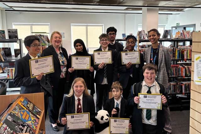 Julie Broadbent with students in Northampton International Academy Library