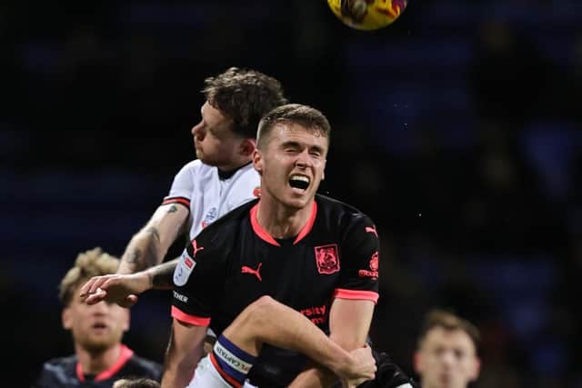 Max Dyche challenges for the ball in the Cobblers' clash at Bolton Wanderers (Picture: Pete Norton)