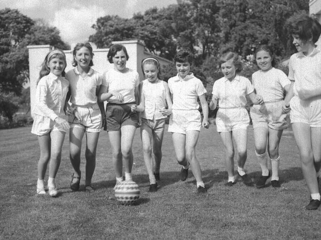 This image, again undated and without a location, shows a group of young girls playing outside.