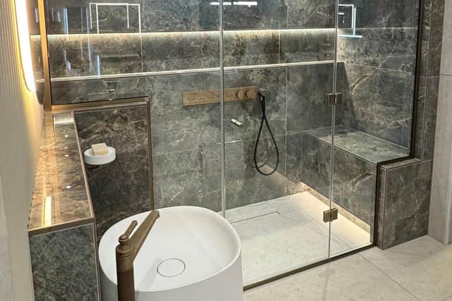 The new bathroom showroom showcases a wet room with chromotherapy shower, featuring innovative touches such as lighting