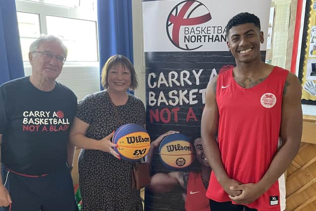 Andre pictured with Councillor Emma Roberts and Martin Spencer.