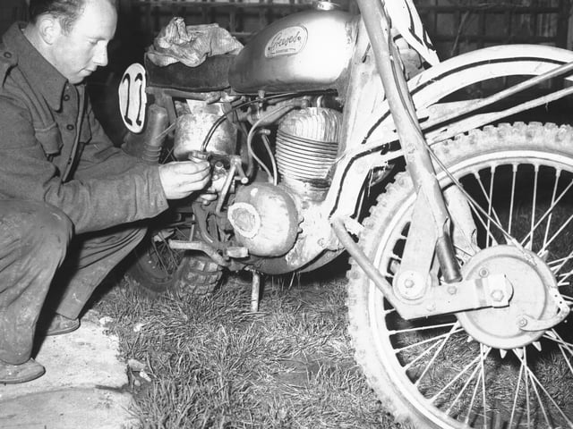 Looking Back old glass negs December 25, 1964 Wild and Woolly Scramble preparations. Man adjusting carburettor on his Villiers-engined Greeves motorbike