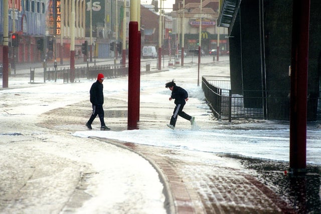 Youngsters caught in flood water at Blackpool as the tide crashed on to the promenade in 1998
