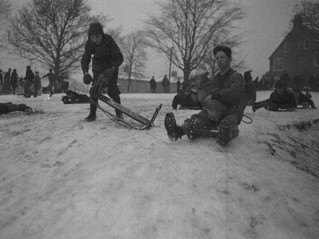 Early 1960s, sledges in the snow