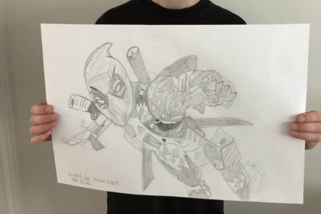 Archie, aged nine, with his Tim Rogerson recreation