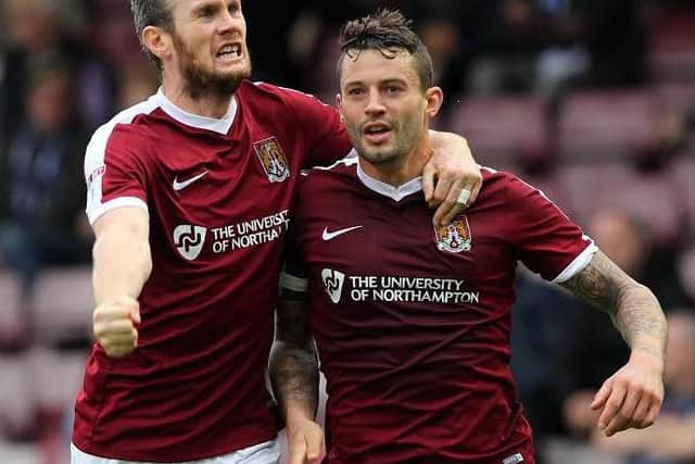 GET IN THERE! - Zander Diamond helps Marc Richards celebrate his opening goal against Bury (Pictures: Sharon Lucey)