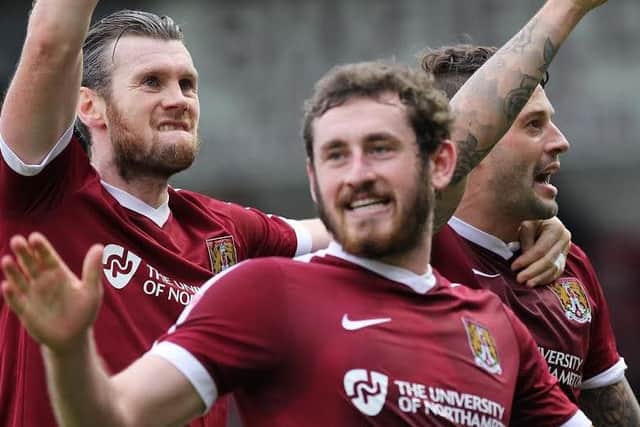 The Cobblers celebrate the opening goal
