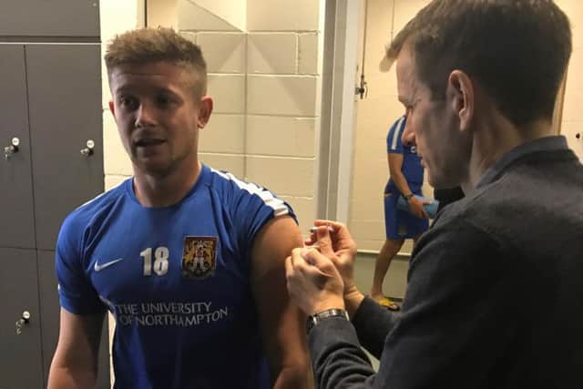 Cobblers player Aaron Phillips gets his flu jab
