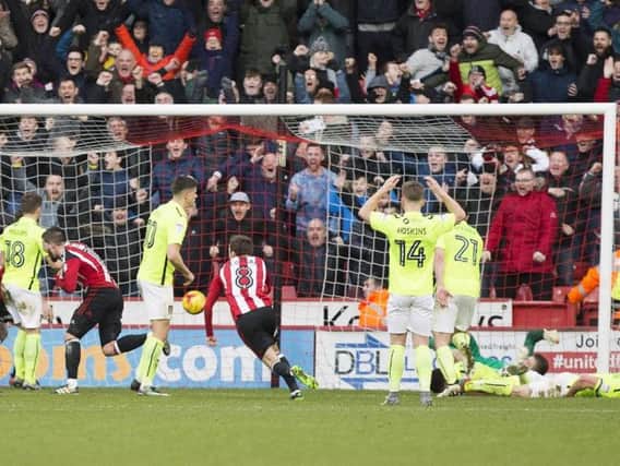 LAST-GASP: Sheffield United celebrate as Cobblers despair after Freeman's 88th minute winner. Pictures: Kirsty Edmonds
