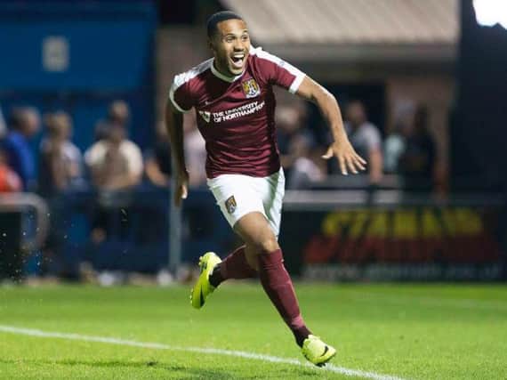 HIGH POINT - Kenji Gorre celebrates scoring the winning penalty in the shootout win over Premier League West Bromwich Albion at Sixfields