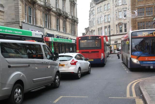 Buses and cars on the Drapery
