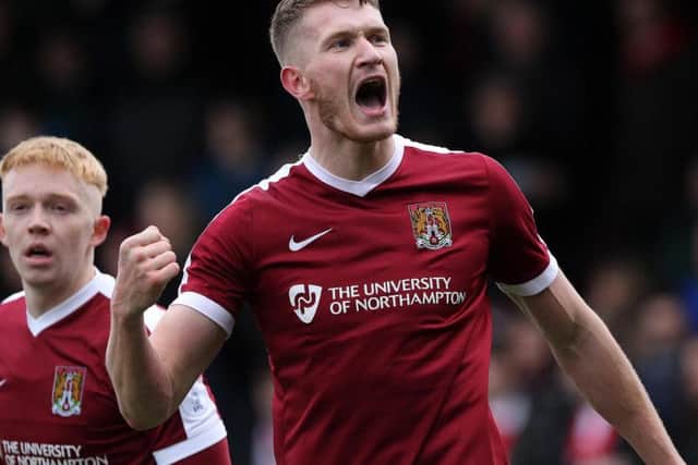 Michael Smith celebrates his goal